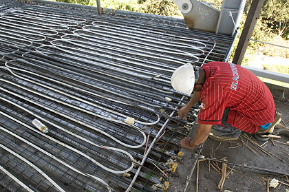 Coils in the floor of Gallagher Hall carry either hot or cold water and use radiant heat and cooling to maintain a comfortable temperature.